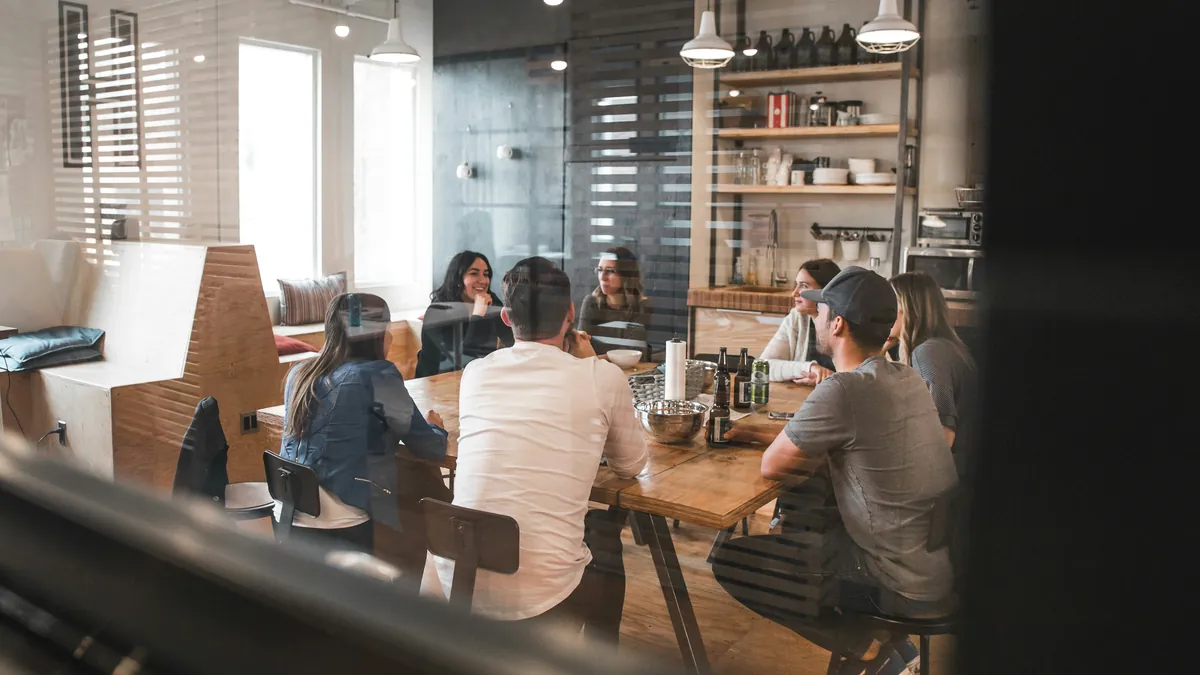 B2B agency team discussing client pipeline
