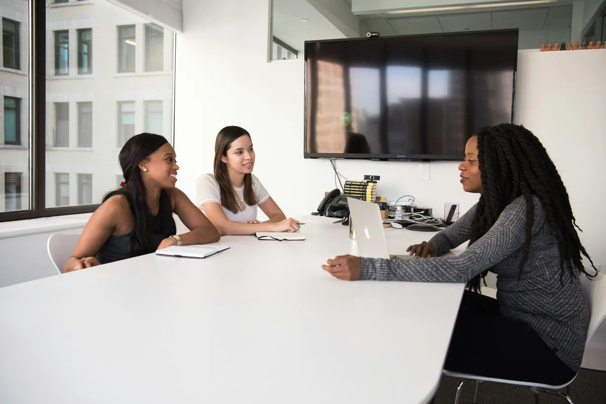 Recruiting team reviewing candidate sourcing in a meeting